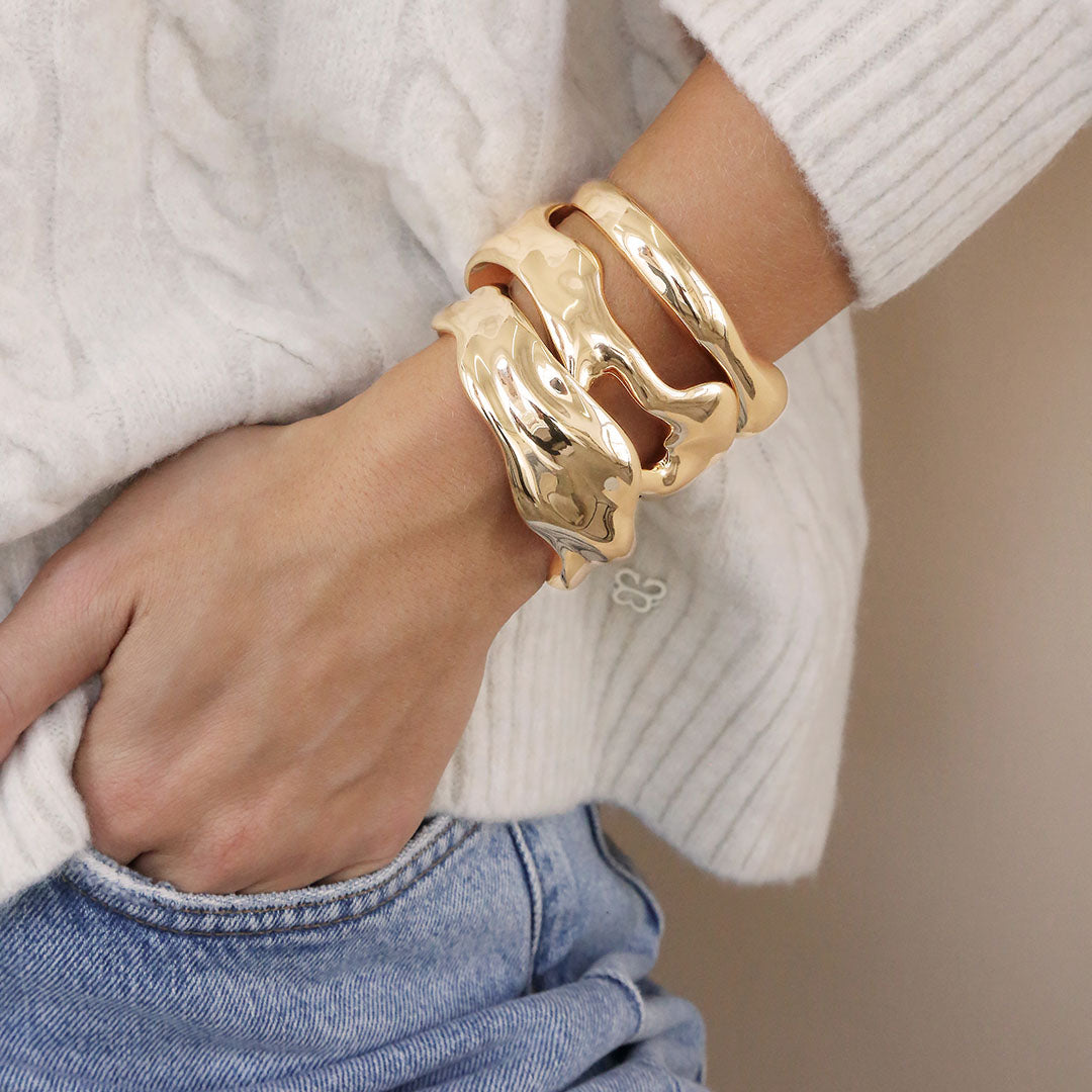 model in gold bracelets