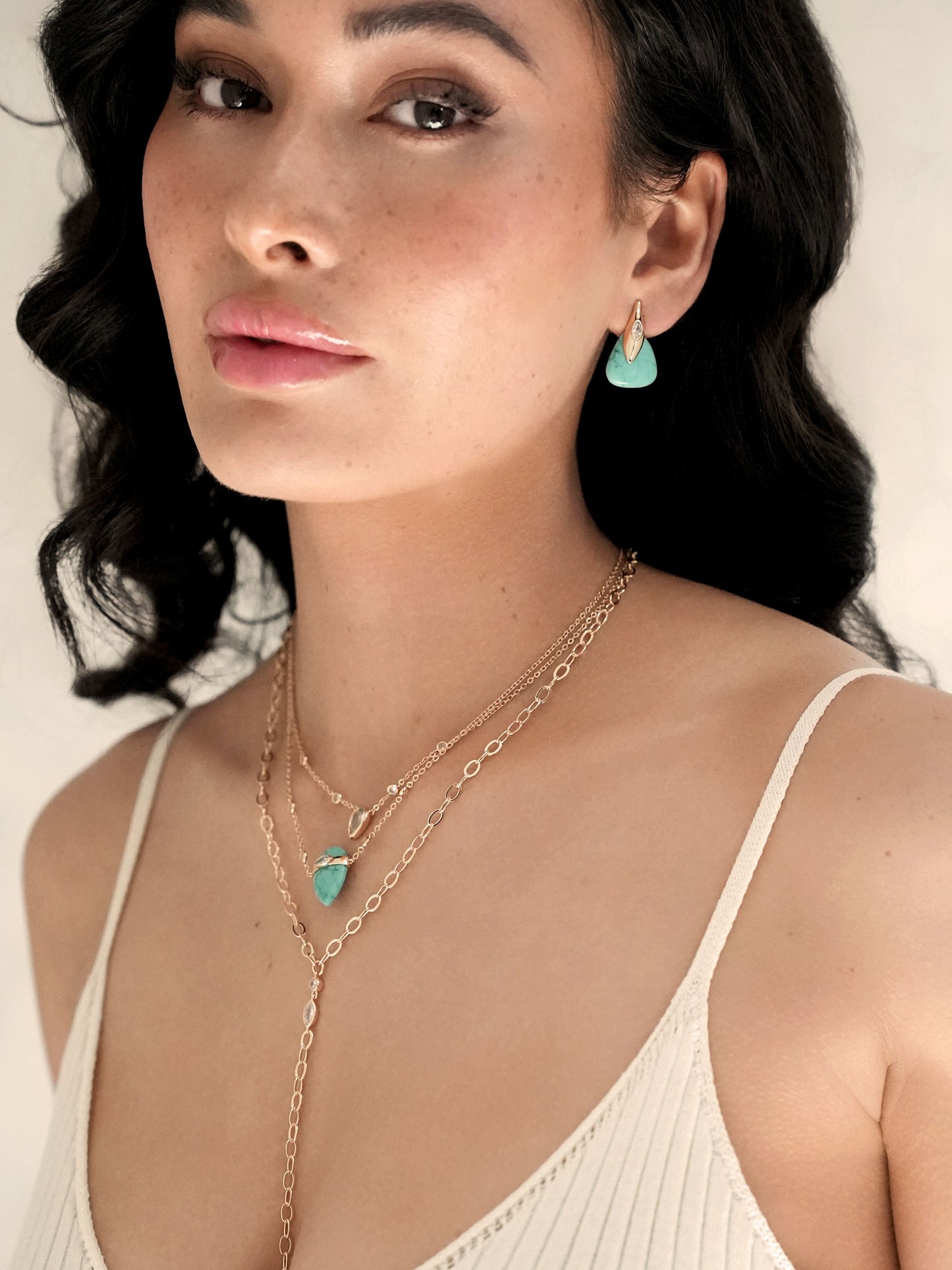 Turquoise Solstice Earrings on model 3