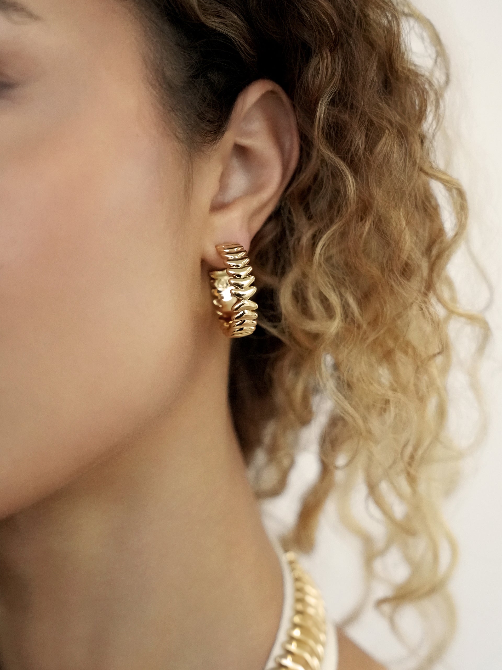 Medium Metal Moderna Hoops on model