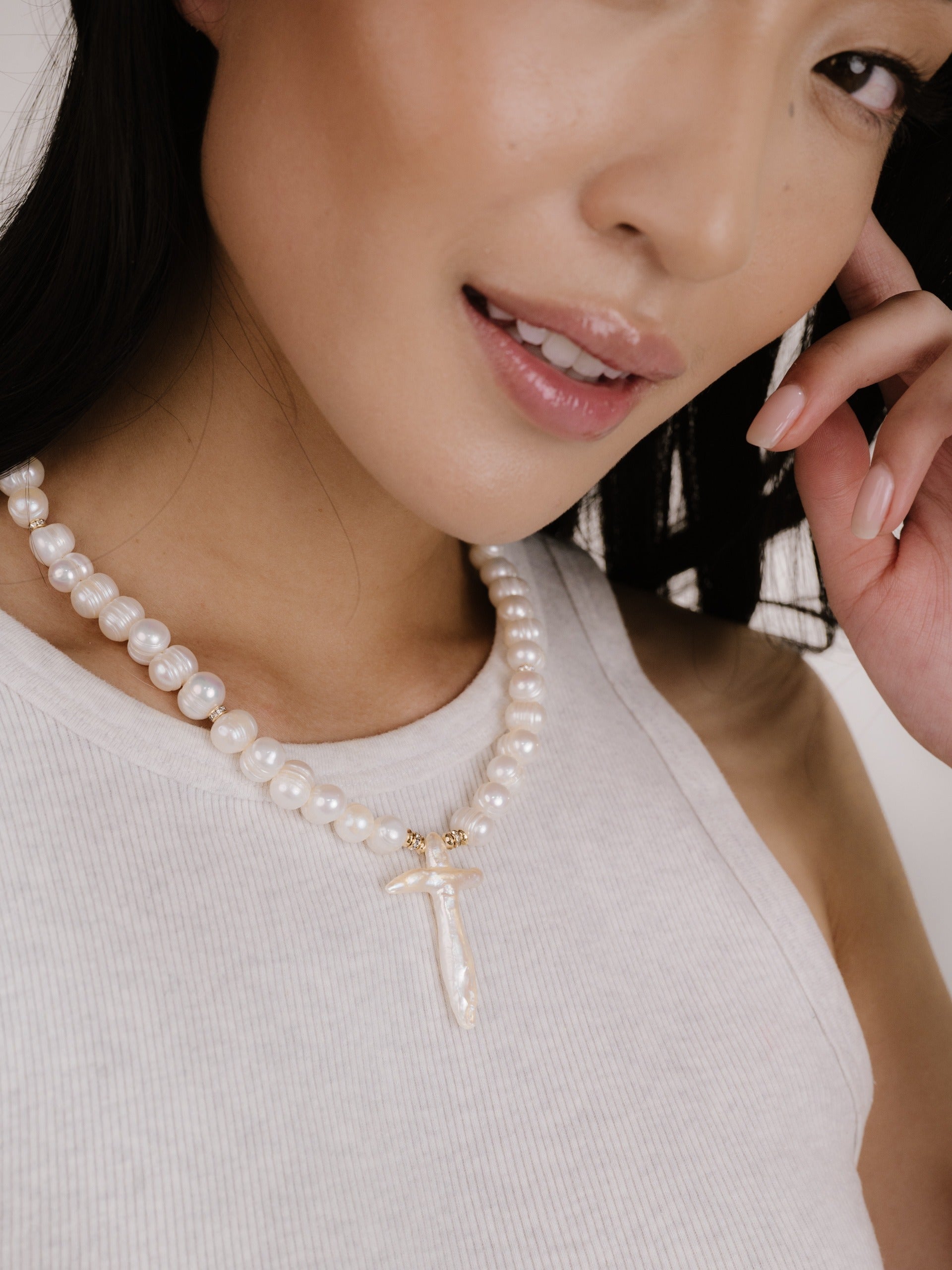 Organic Pearl Cross Necklace on model 3