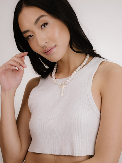 Organic Pearl Cross Necklace on model 4