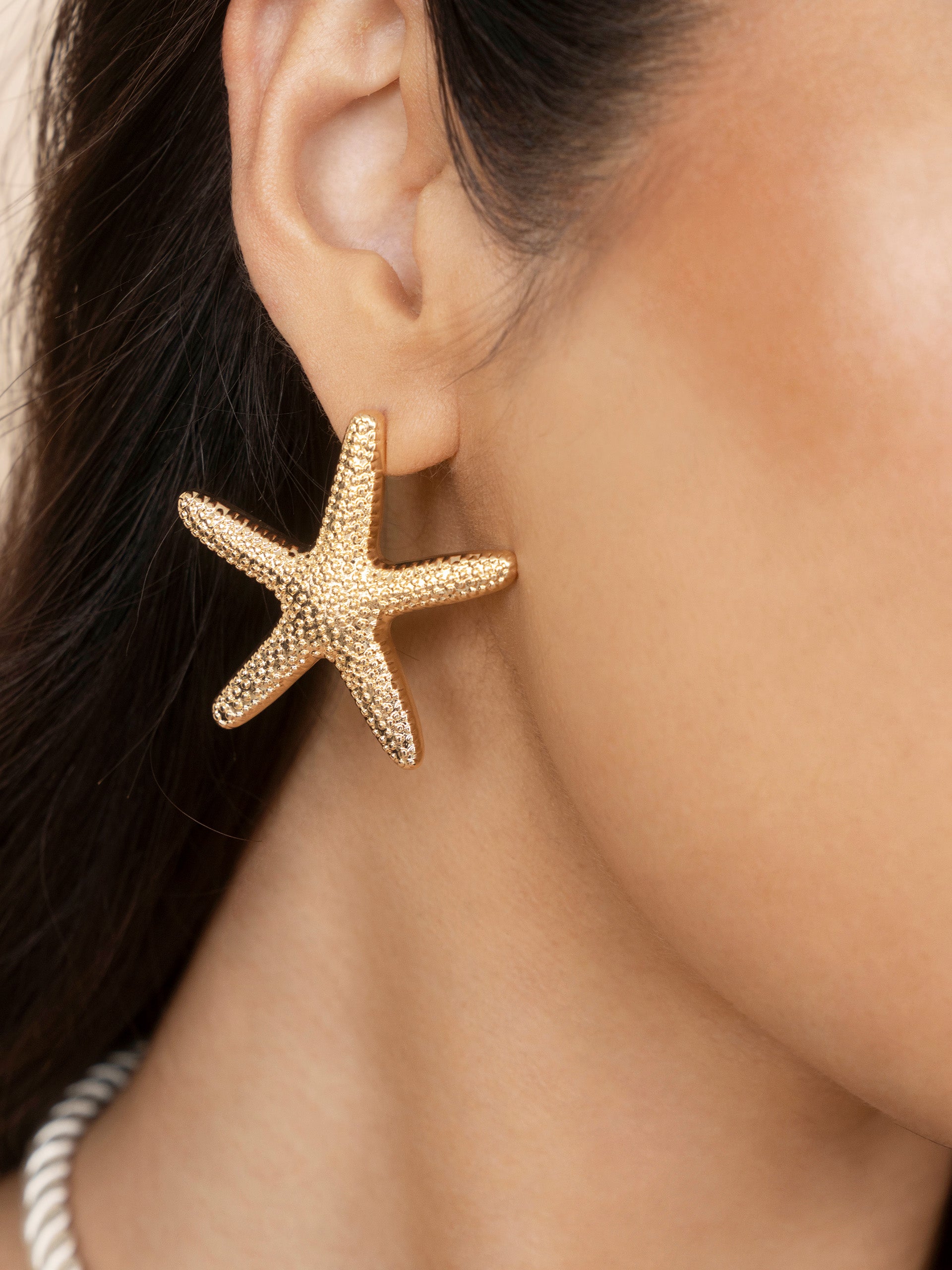 Statement Starfish Stud Earrings on model
