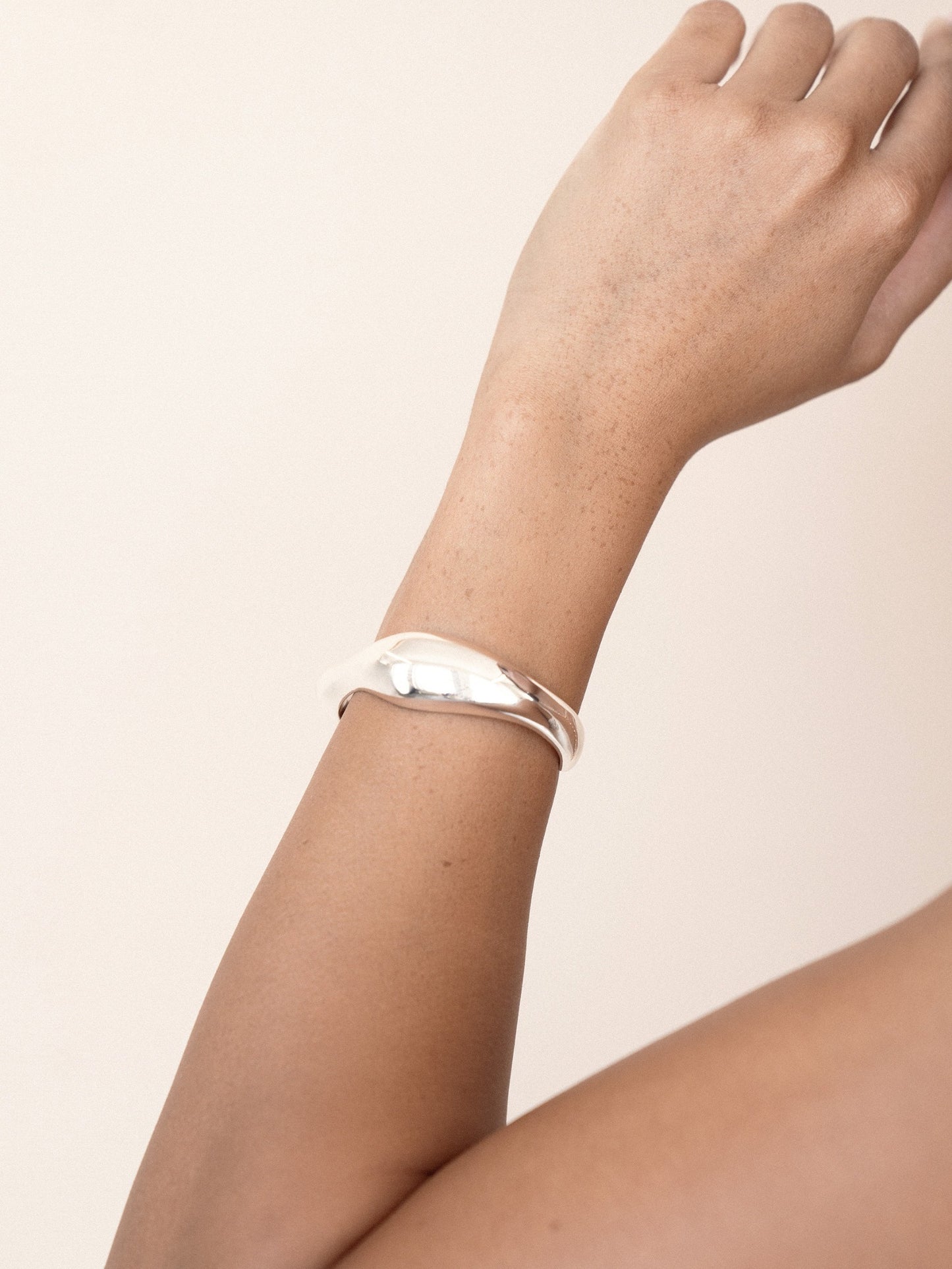 Liquid Love Cuff in silver on model