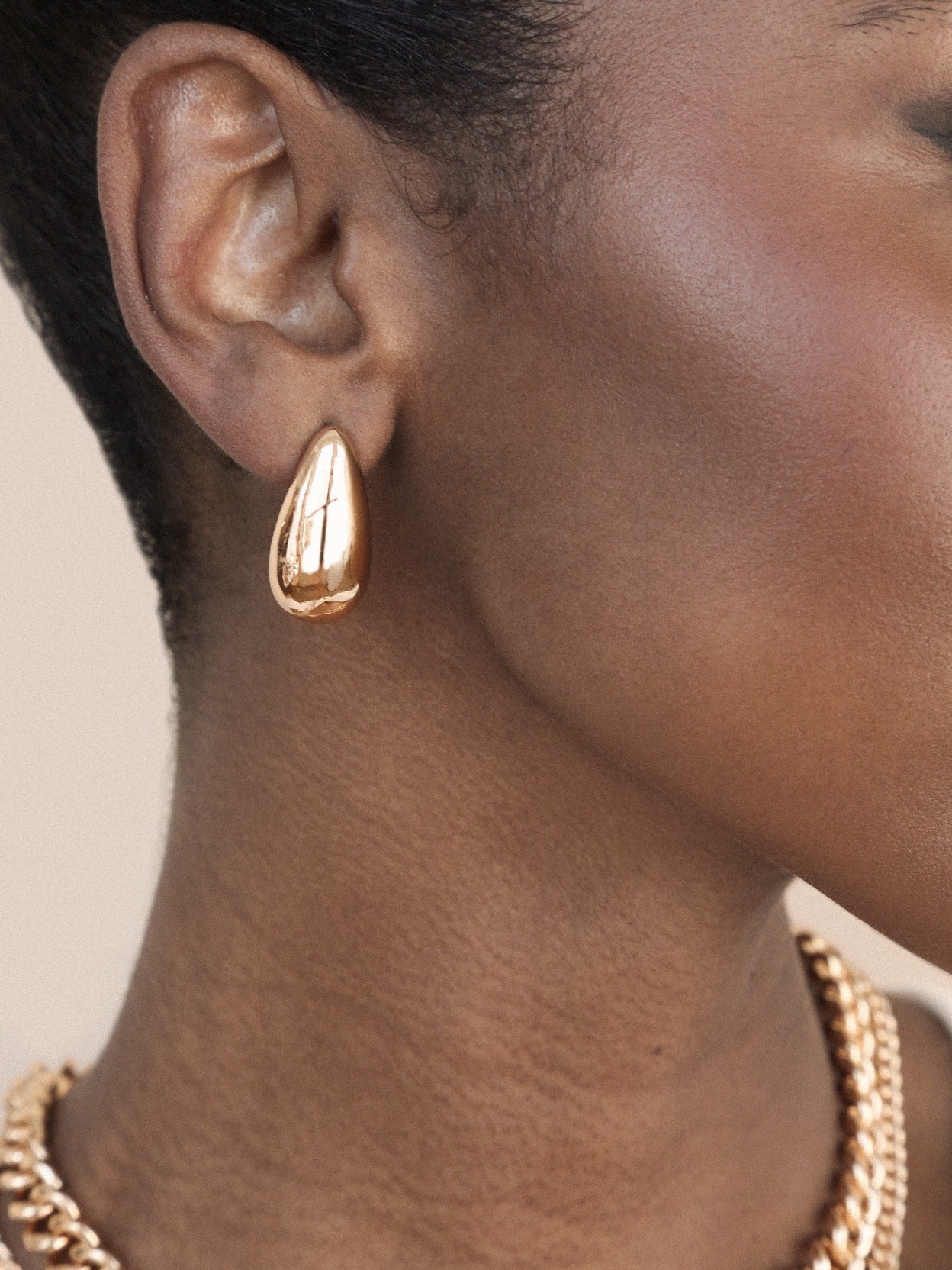 Golden Teardrop Earrings on model 2