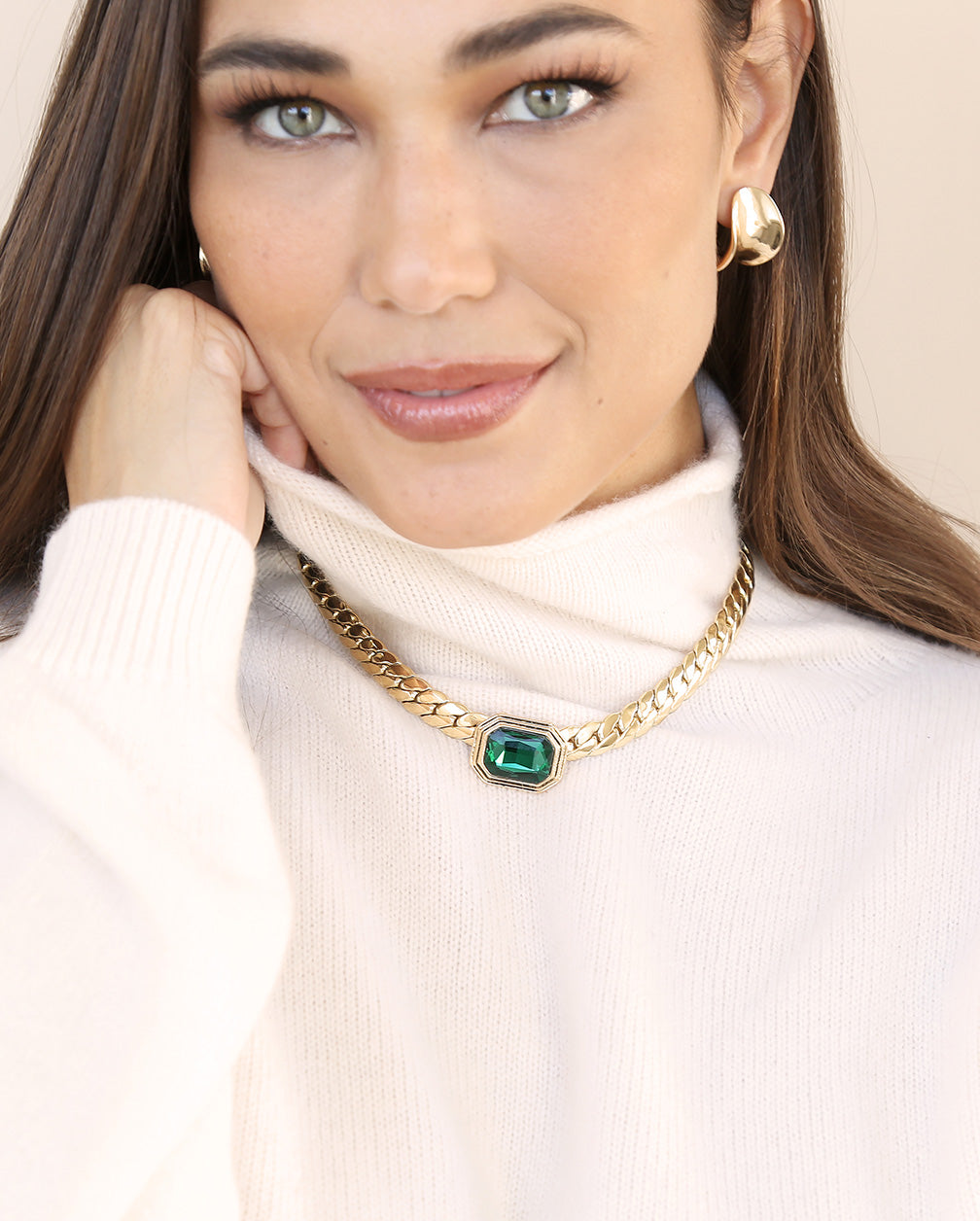 model in emerald necklace