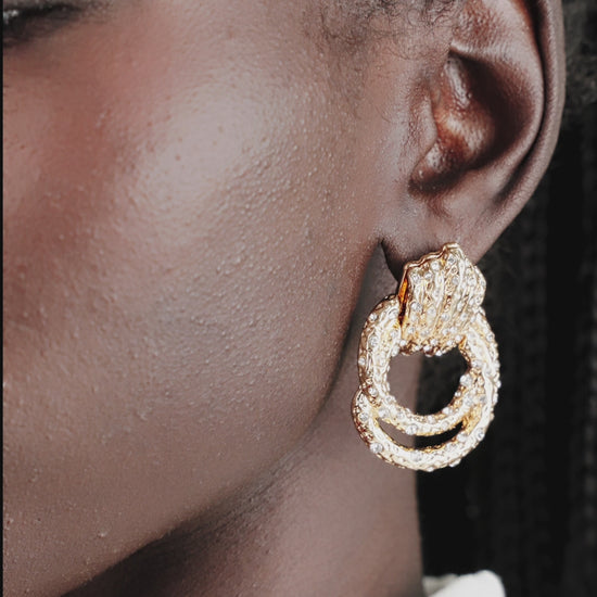 Only Royalty Crystal Earrings on model in video